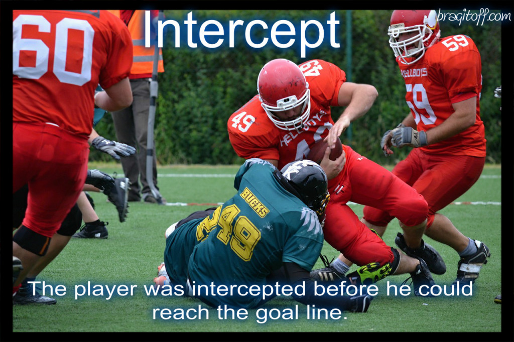 image sentence: The player was intercepted before he could reach the goal line.